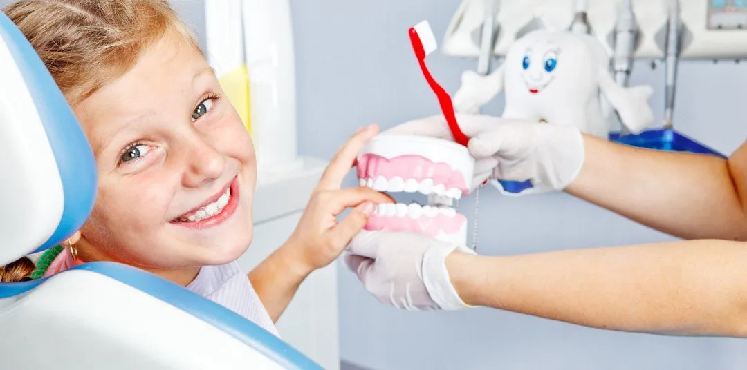 Happy child with toy dentures