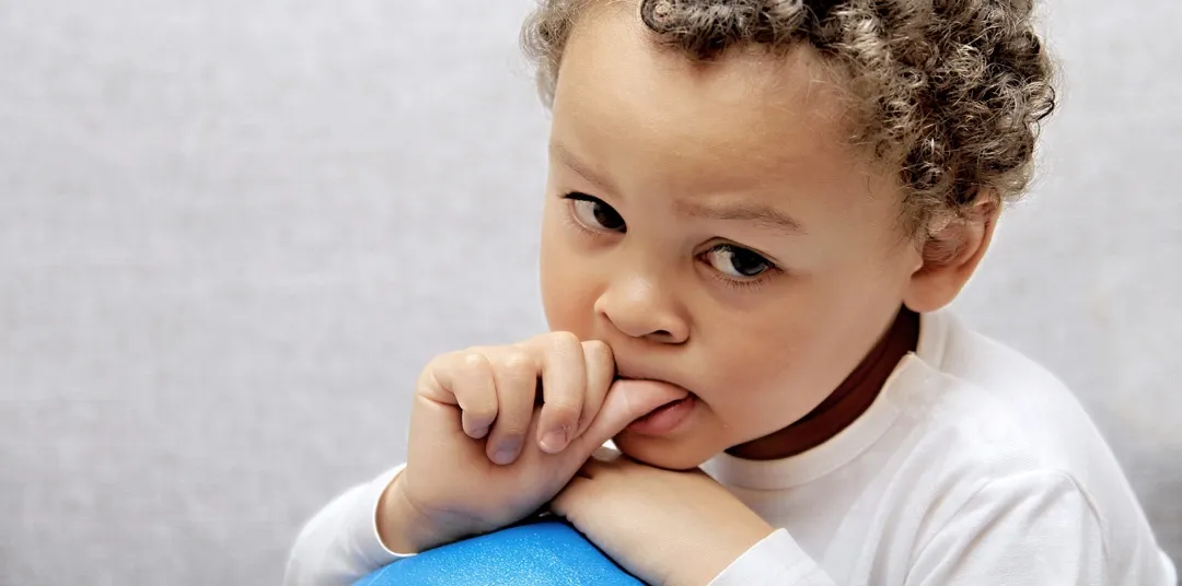 little boy sucking his thumb