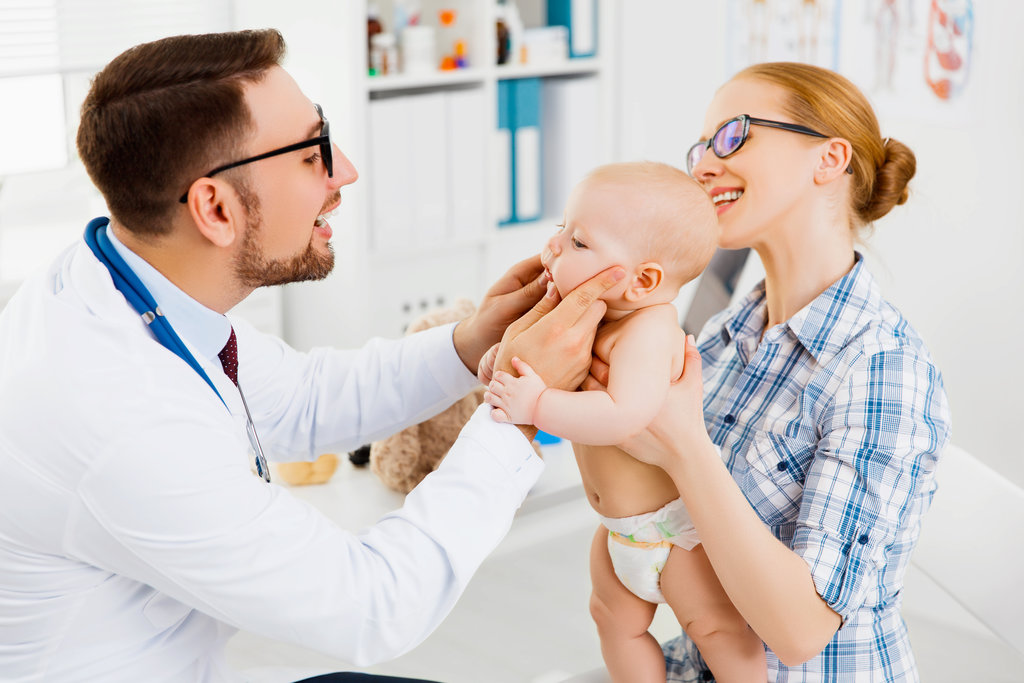 mother and baby toddler on reception at the child pediatrician