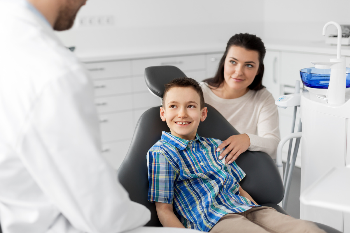 mother and son visiting dentist at dental clinic
