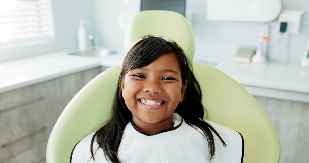 Dental, smile and face of girl at a dentist for teeth whitening, consultation or growth check. Oral care, portrait and happy kid in dentistry office for mouth, gum or consulting specialist for braces.